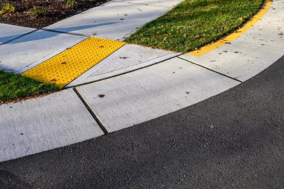 Curb cut at corer of sidewalk